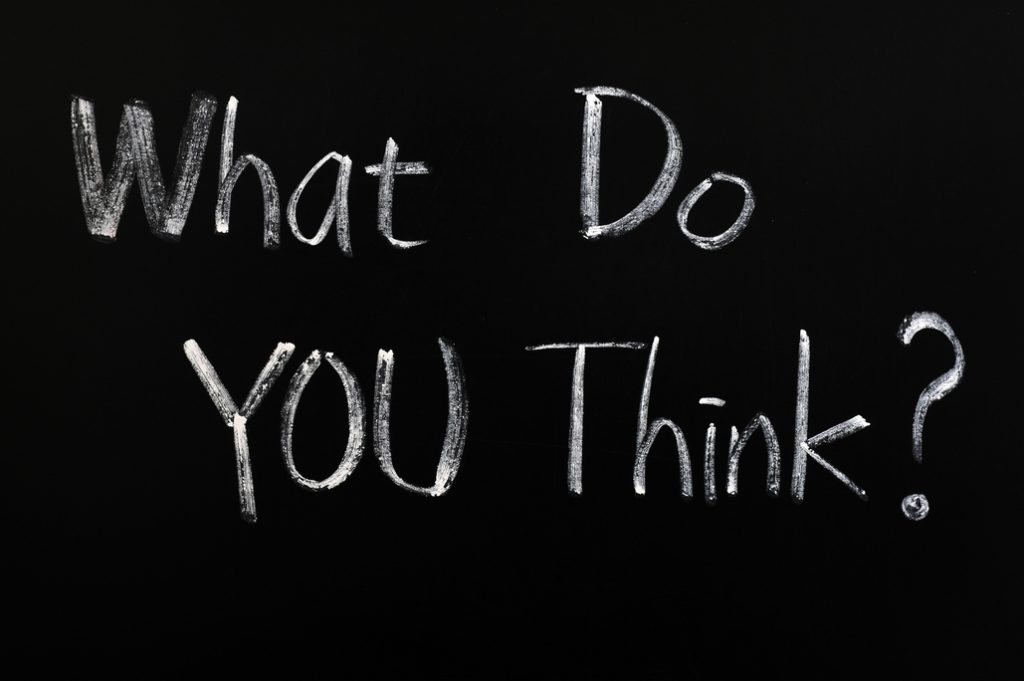 The question 'What do you think?' written on a blackboard