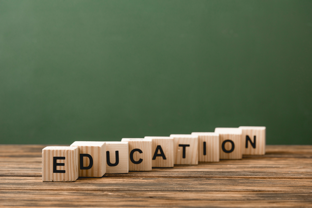 Word education spelled out in wooden bricks