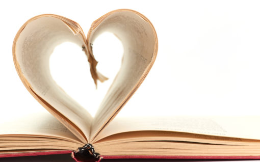 pages of a book curved into heart