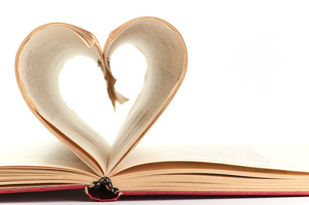 pages of a book curved into heart